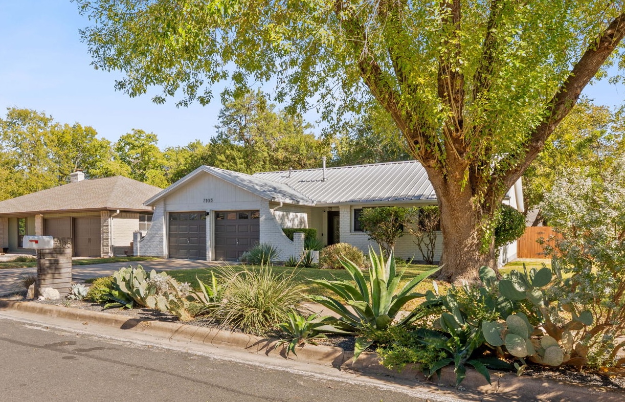 7105 Windrift Way Austin, TX 78745 - Photo 3 of 32 a view of a house with a tree in front of it