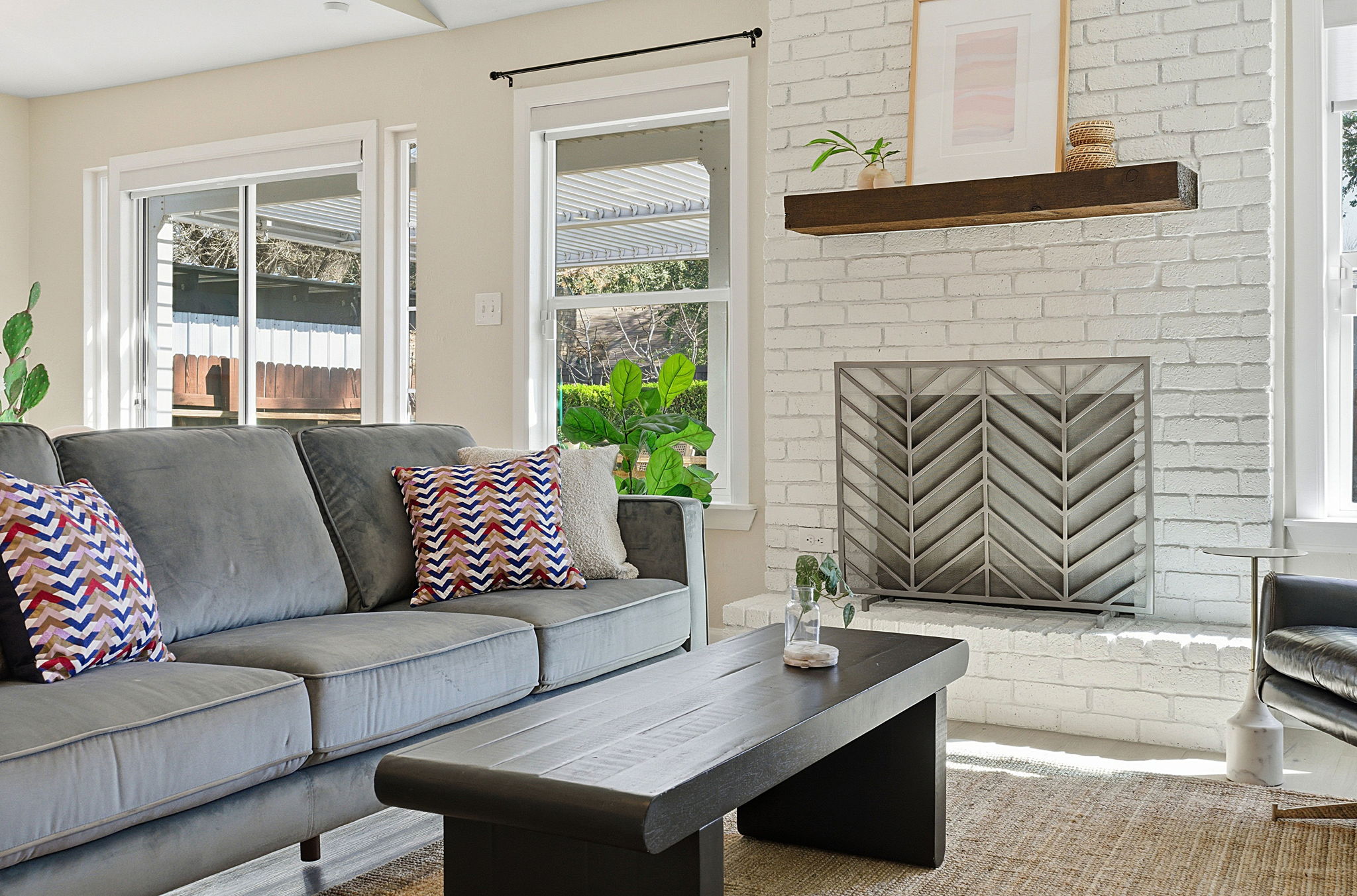 7105 Windrift Way Austin, TX 78745 - Photo 7 of 32 a living room with furniture and a fireplace