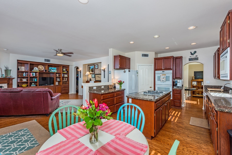 2337 Longfellow Road Carlsbad, CA 92008 - Photo 8 of 25 Eat-in kitchen and family room with fireplace comprise a wonderful great room.