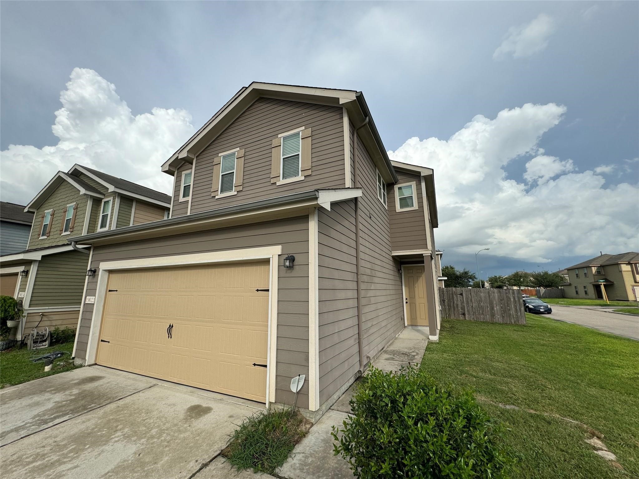 19022 Bee Line Court Houston, TX 77073 - Photo 4 of 12 a front view of a house with garden