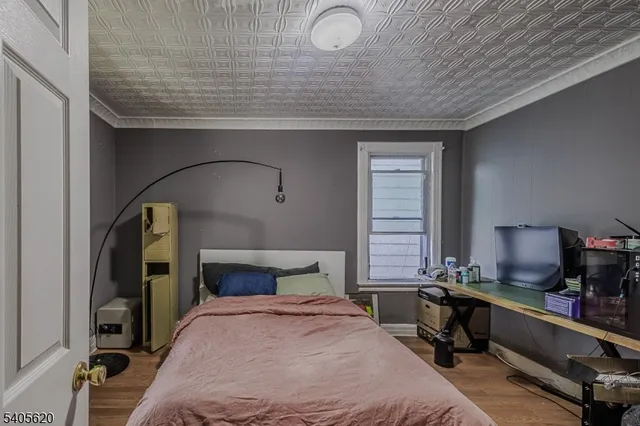 a view of a livingroom with furniture and a flat screen tv
