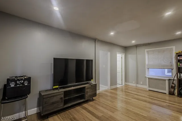 a bathroom with a sink toilet vanity and shower
