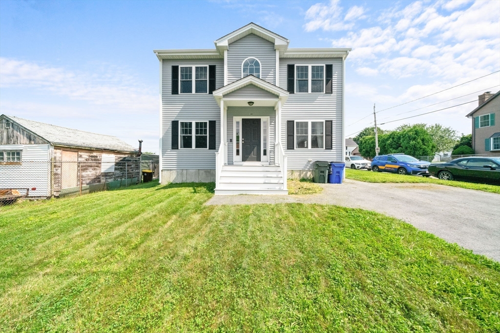 38 Renaud Street Fall River, MA 02721 - Photo 1 of 25 a front view of a house with a yard