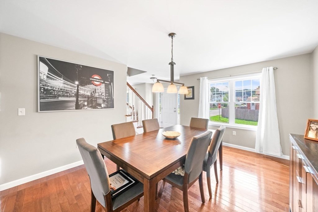 38 Renaud Street Fall River, MA 02721 - Photo 11 of 25 a view of a dining room with furniture window and wooden floor