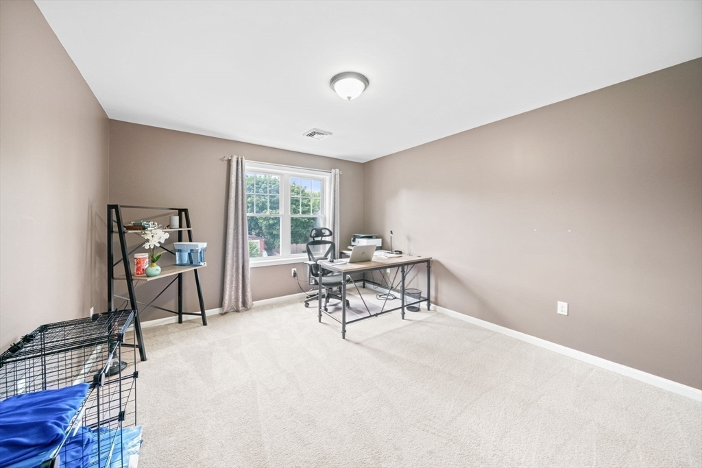 38 Renaud Street Fall River, MA 02721 - Photo 18 of 25 a living room with furniture and a window