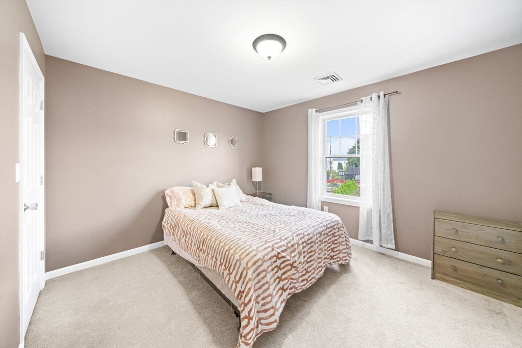 38 Renaud Street Fall River, MA 02721 - Photo 19 of 25 a bedroom with a bed and a window