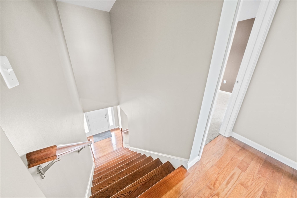 38 Renaud Street Fall River, MA 02721 - Photo 20 of 25 a view of a room with wooden floor and staircase
