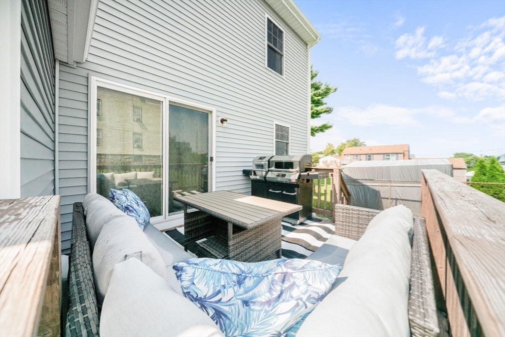 38 Renaud Street Fall River, MA 02721 - Photo 21 of 25 a balcony with furniture and a table