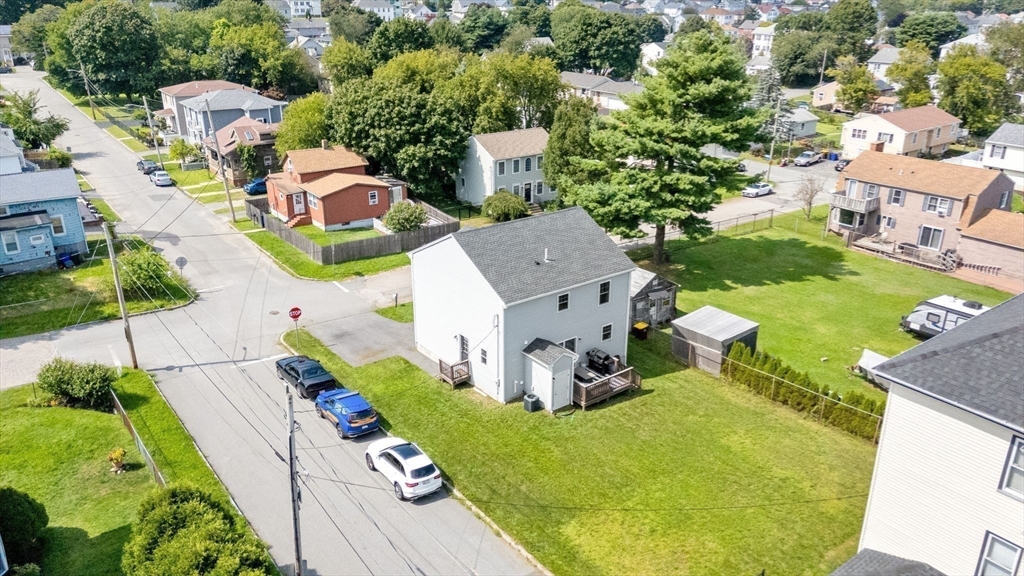 38 Renaud Street Fall River, MA 02721 - Photo 23 of 25 an aerial view of a house with garden space and street view