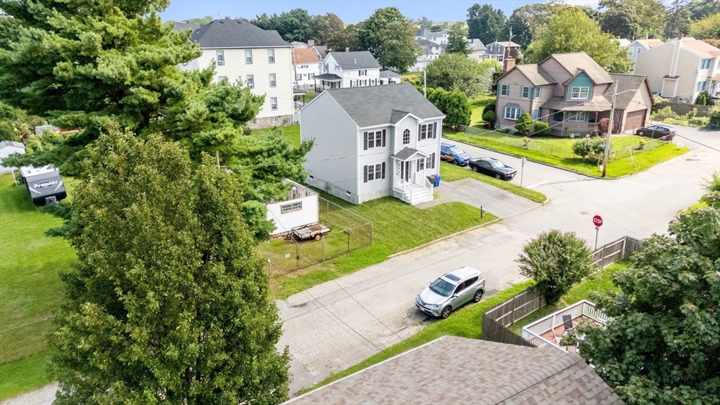 38 Renaud Street Fall River, MA 02721 - Photo 3 of 25 an aerial view of a house with a garden and swimming pool