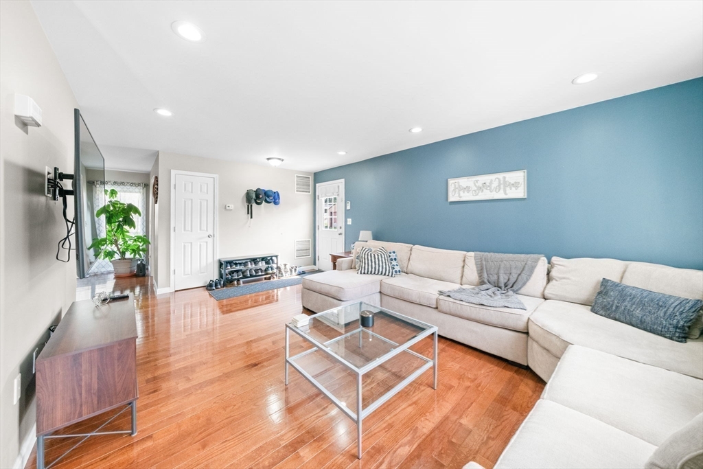 38 Renaud Street Fall River, MA 02721 - Photo 6 of 25 a living room with furniture and a wooden floor