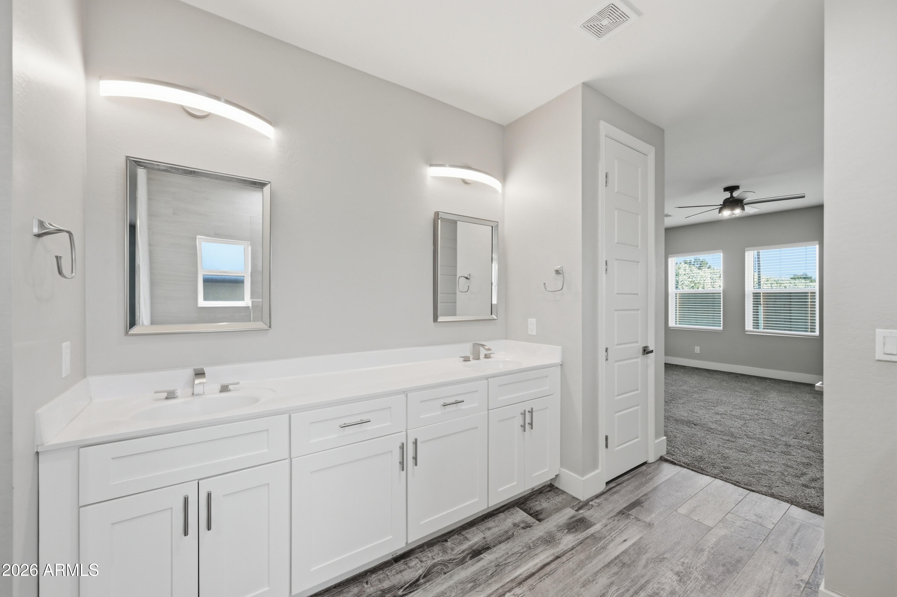 431 North Matlock Street Mesa, AZ 85203 - Photo 13 of 33 a spacious bathroom with a double vanity sink a mirror and a shower