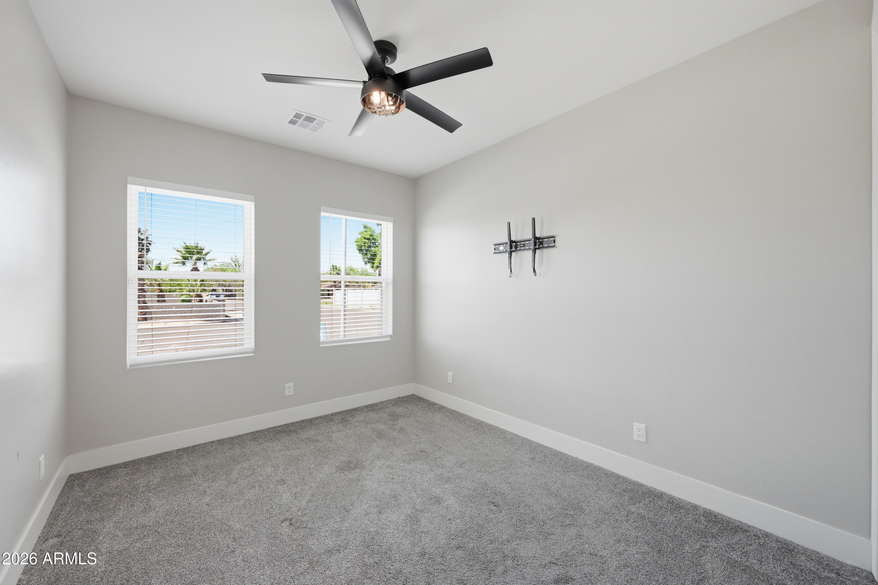 431 North Matlock Street Mesa, AZ 85203 - Photo 19 of 33 an empty room with a window and a fan