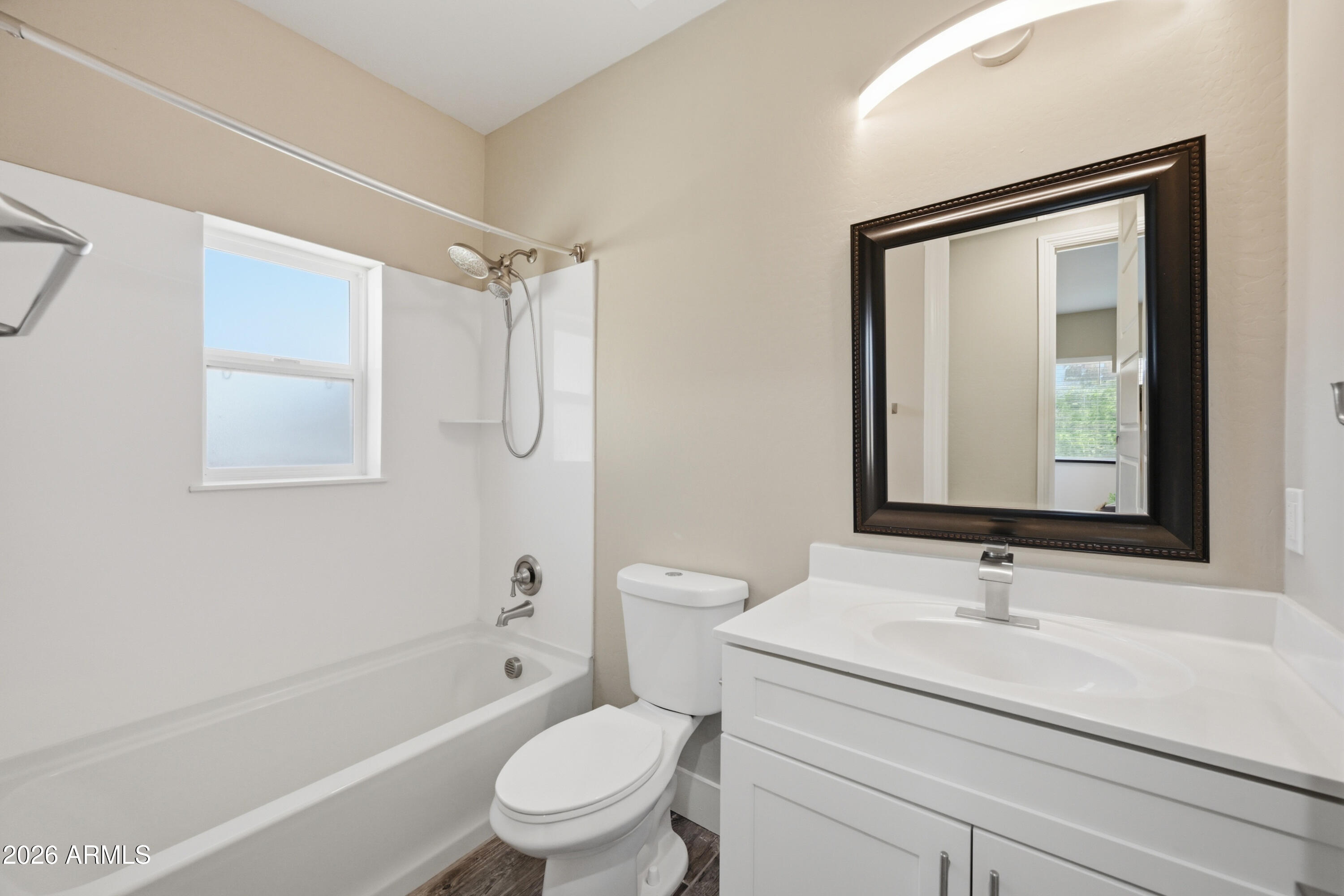 431 North Matlock Street Mesa, AZ 85203 - Photo 23 of 33 a bathroom with a granite countertop sink toilet a mirror and shower