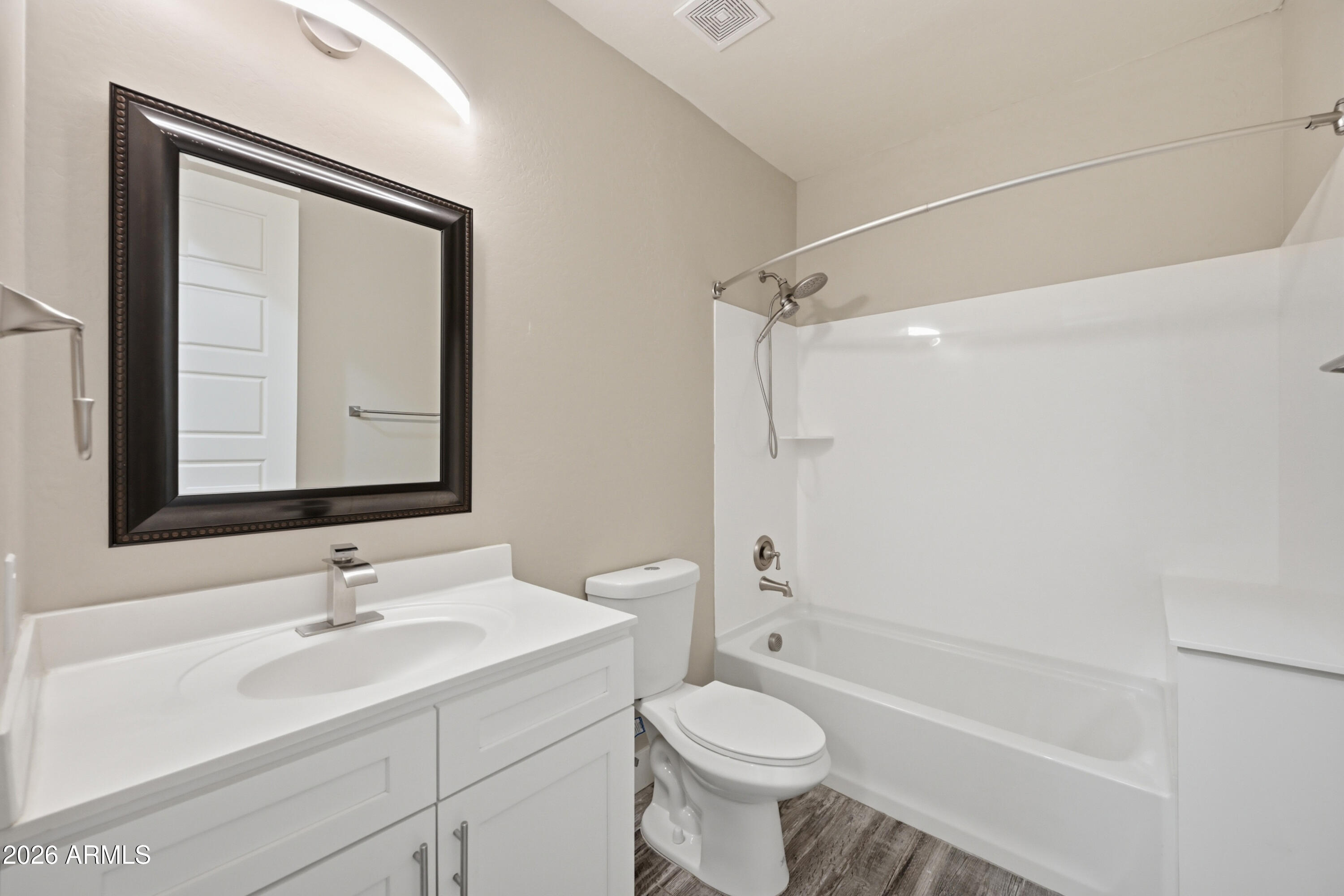 431 North Matlock Street Mesa, AZ 85203 - Photo 24 of 33 a bathroom with a sink toilet a mirror and shower