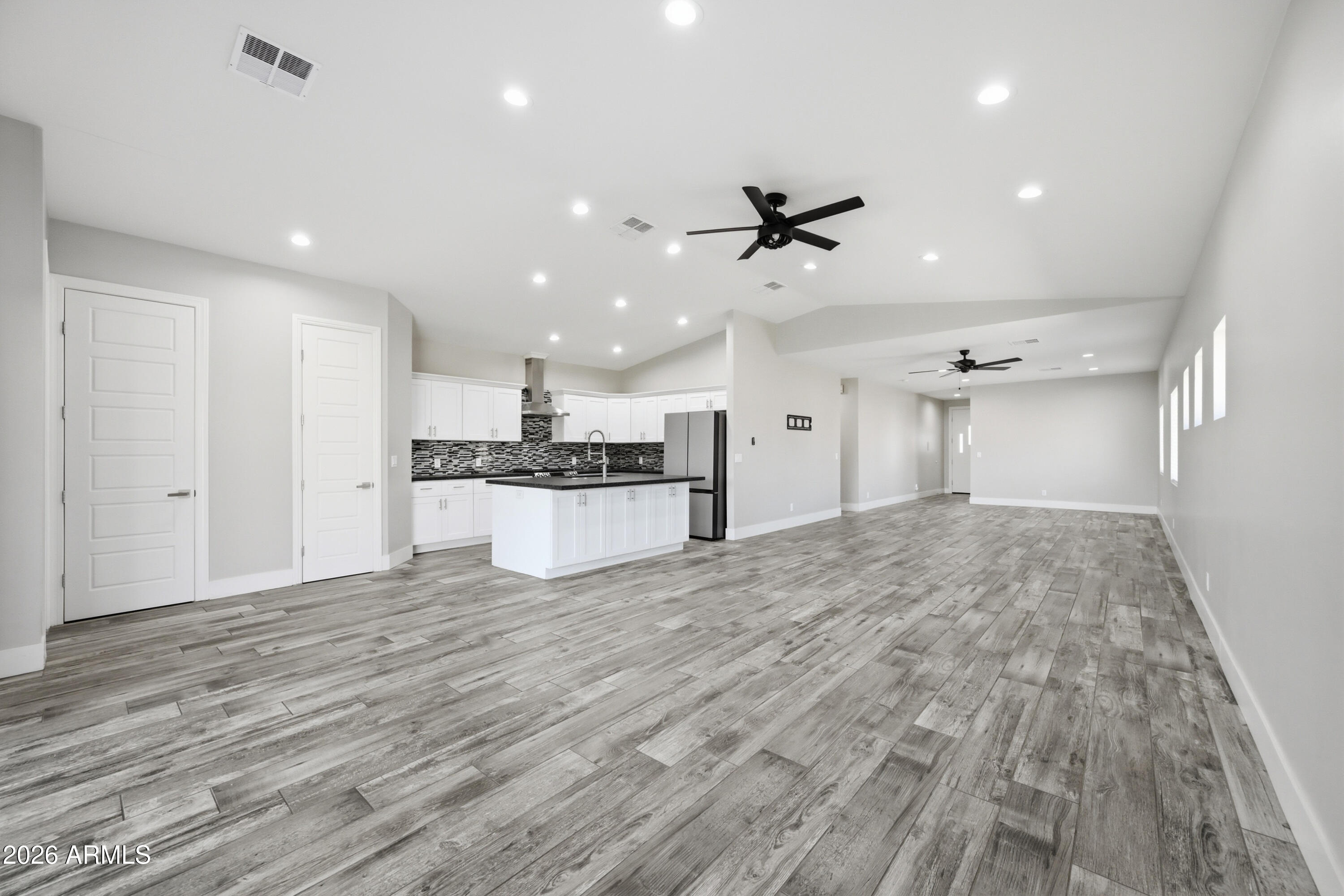 431 North Matlock Street Mesa, AZ 85203 - Photo 5 of 33 a view of a kitchen with a sink and wooden floor