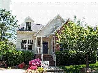 62 Renwick Court Raleigh, NC 27615 - Photo 1 of 1 a front view of a house with a yard