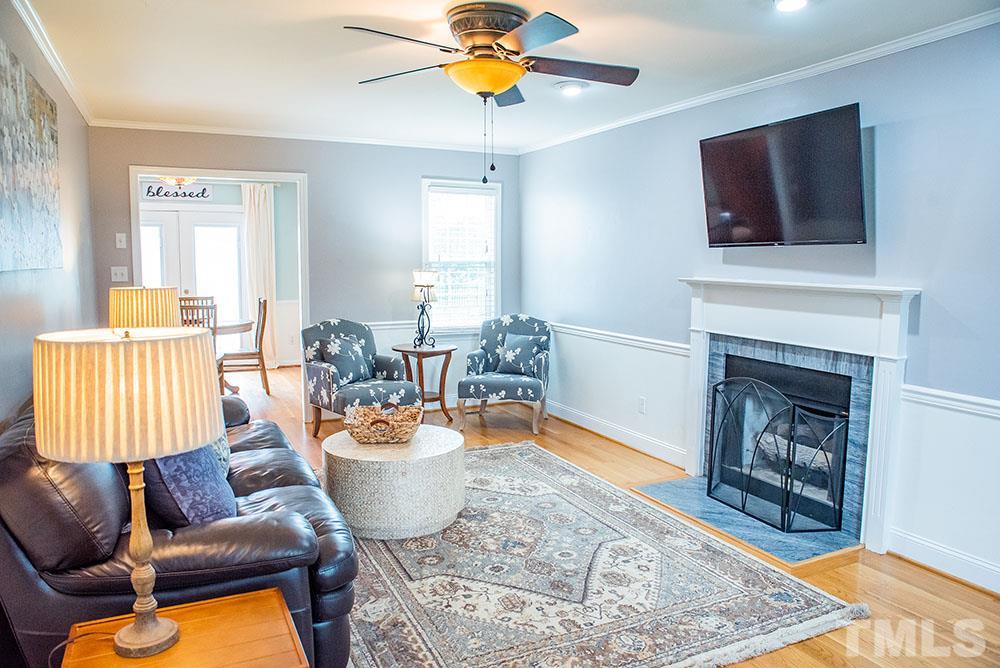 2266 Thee Hester Road Roxboro, NC 27574 - Photo 3 of 29 a living room with furniture and a fireplace