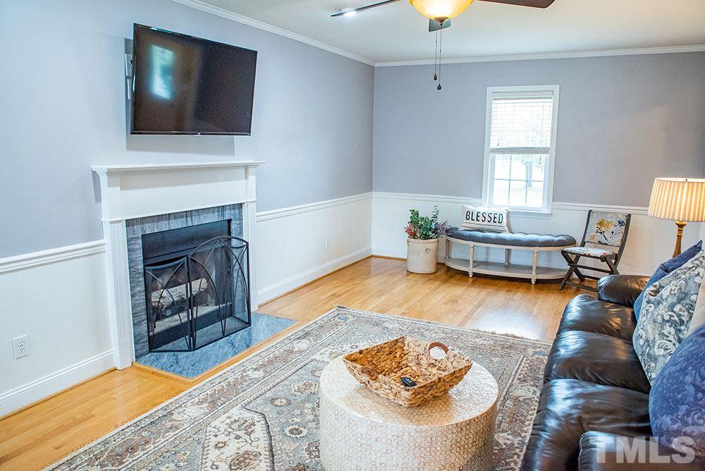 2266 Thee Hester Road Roxboro, NC 27574 - Photo 5 of 29 a living room with furniture and a fireplace