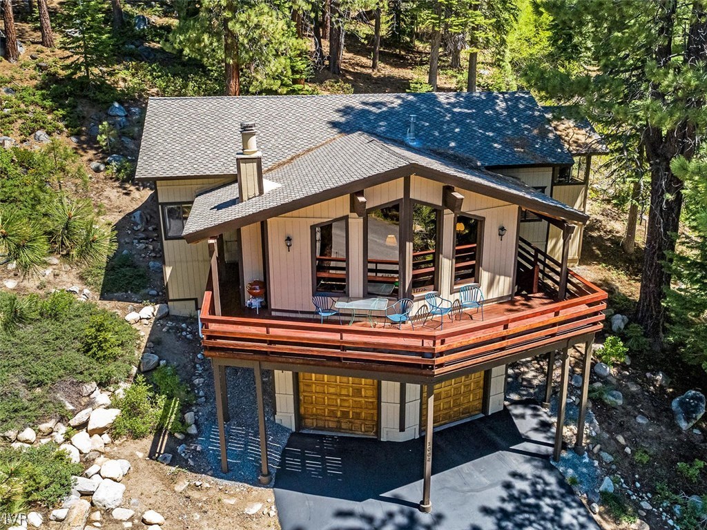 1004 Apollo Way Incline Village, NV 89451 - Photo 1 of 21 a view of house with table and chairs and a barbeque