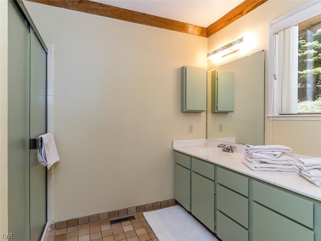 1004 Apollo Way Incline Village, NV 89451 - Photo 12 of 21 a bathroom with a sink and a mirror