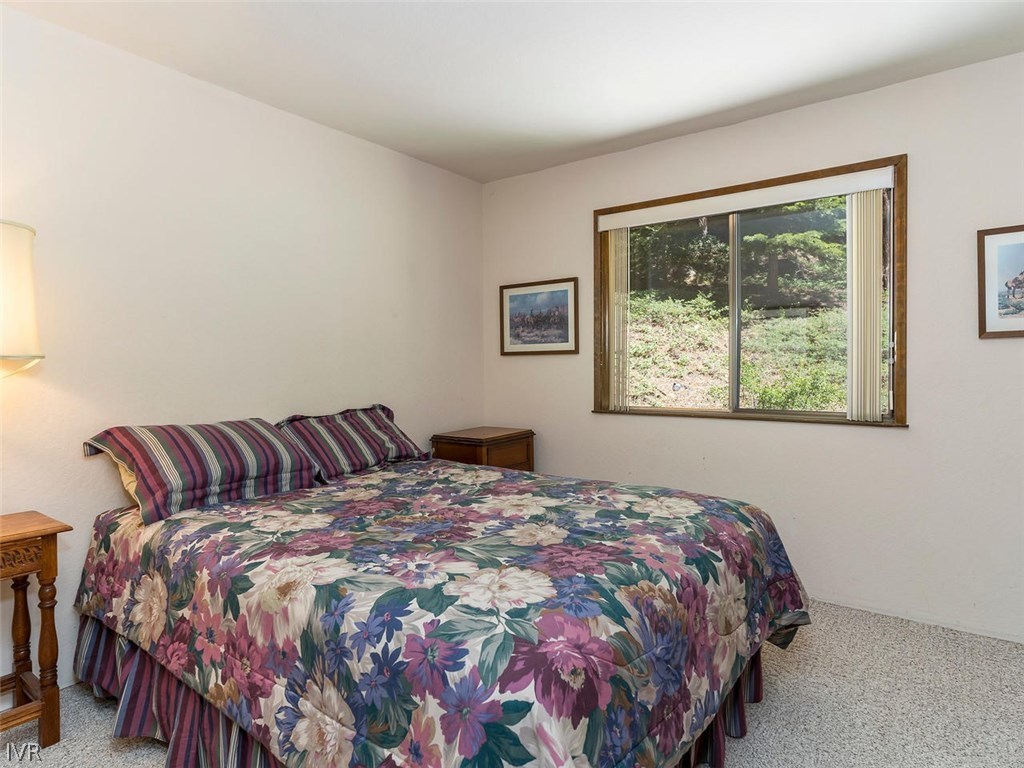 1004 Apollo Way Incline Village, NV 89451 - Photo 14 of 21 a bedroom with a large bed and a window