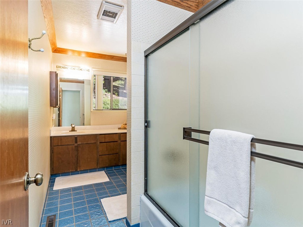 1004 Apollo Way Incline Village, NV 89451 - Photo 15 of 21 a bathroom with a granite countertop sink mirror and toilet