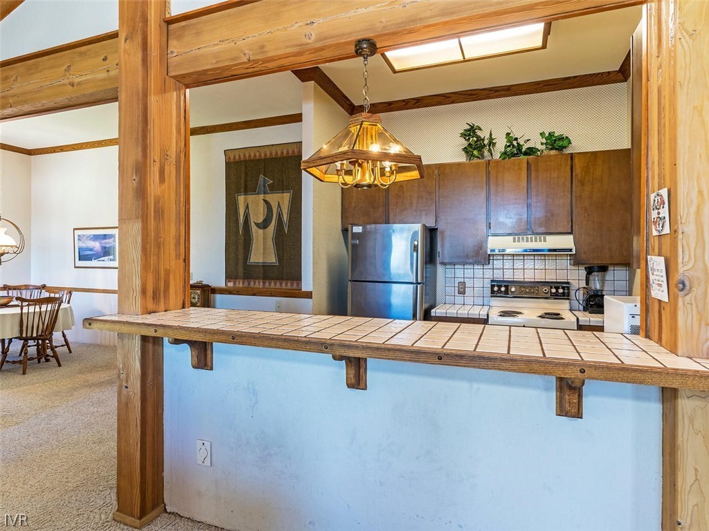 1004 Apollo Way Incline Village, NV 89451 - Photo 5 of 21 a view of a kitchen with a refrigerator a sink and a dishwasher