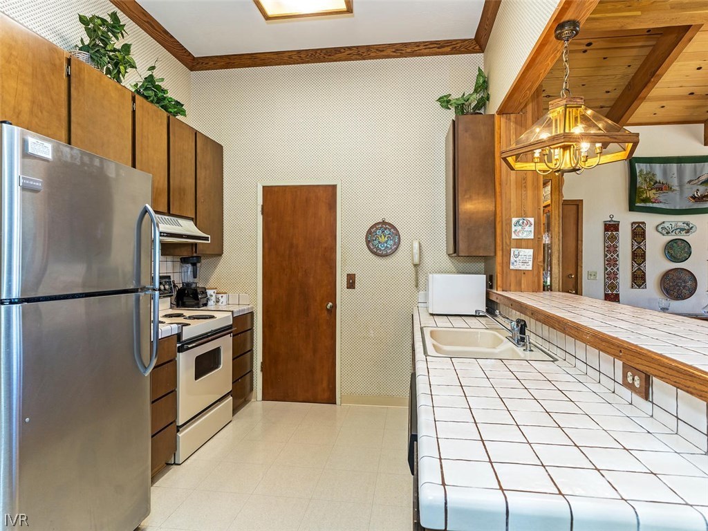 1004 Apollo Way Incline Village, NV 89451 - Photo 6 of 21 a kitchen with stainless steel appliances a refrigerator and a stove