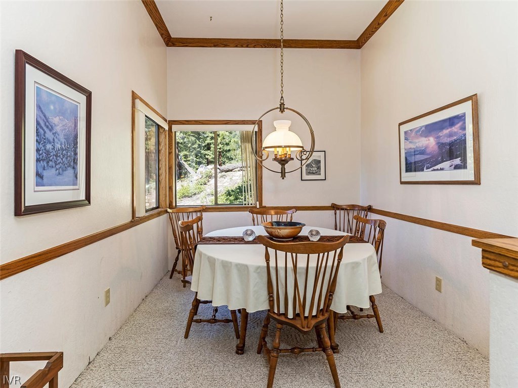 1004 Apollo Way Incline Village, NV 89451 - Photo 7 of 21 a view of a dining room with furniture window and wooden floor
