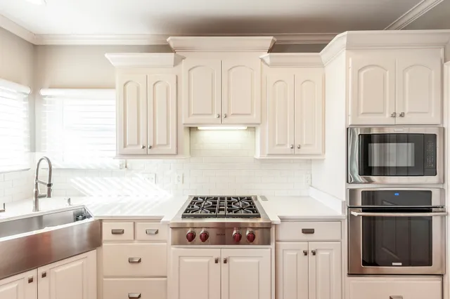 a bedroom with a bed window and a couch