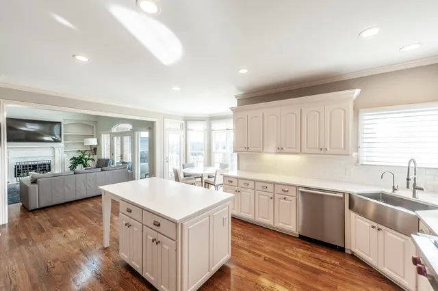 a large bathroom with a glass door shower a sink and a large mirror