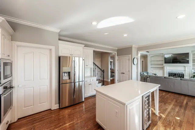 a white tub sitting in a bathroom next to a window