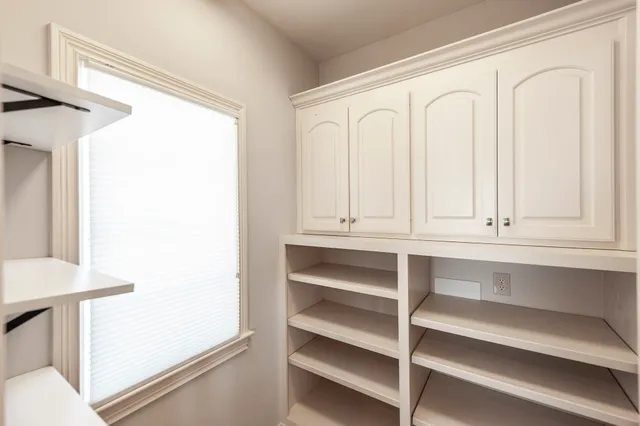 a bathroom with a double vanity sink mirror and shower