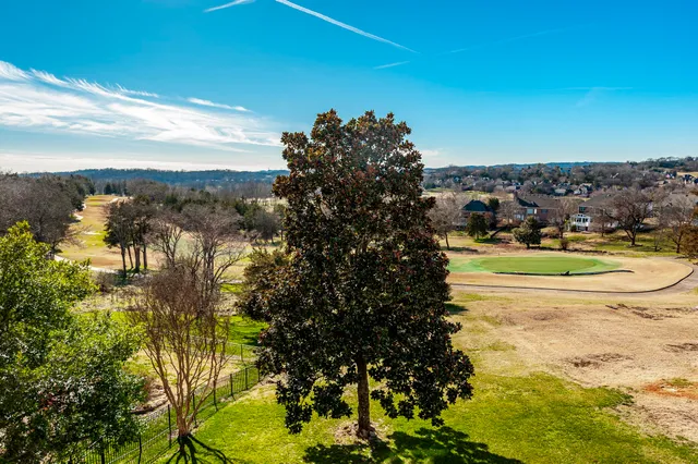 a view of a livingroom with furniture and a window