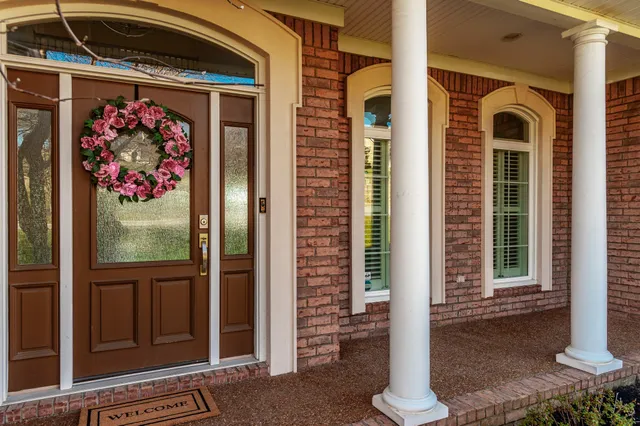 a view of yard with swimming pool and green space