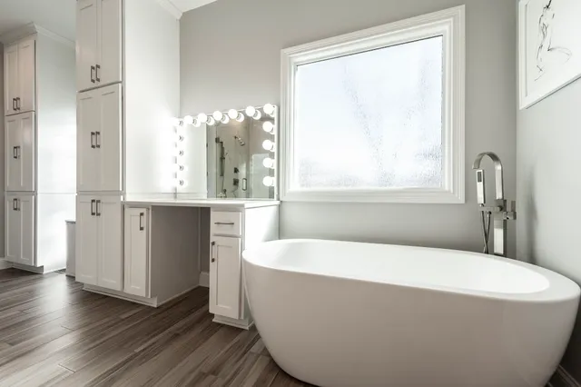 a room with furniture pool table flat screen tv and windows