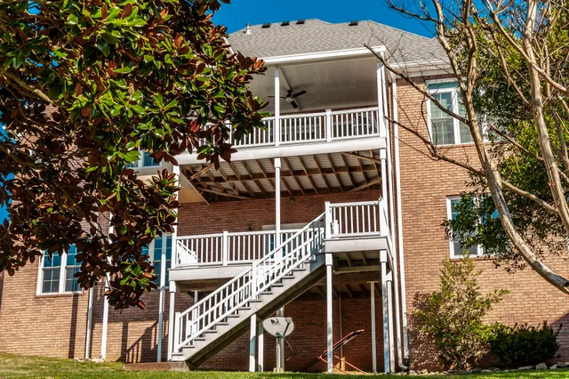 a living room with a fireplace and wooden floor