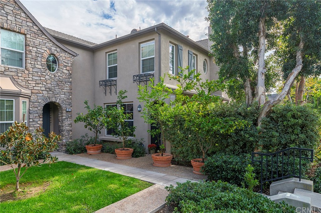 43 Walbert Lane Ladera Ranch, CA 92694 - Photo 1 of 1 a front view of a house with a garden and plants