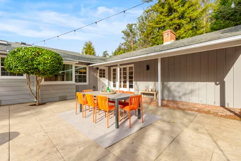 a swimming pool with wooden fence