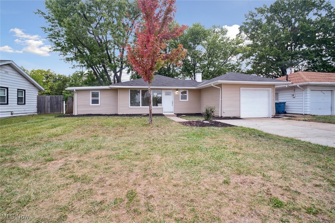 8796 West Ridgewood Drive Cleveland, OH 44130 - Photo 1 of 38 Ranch-style home featuring a front lawn and a garage