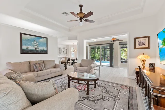 a kitchen with stainless steel appliances granite countertop a sink dishwasher stove and refrigerator with wooden floor