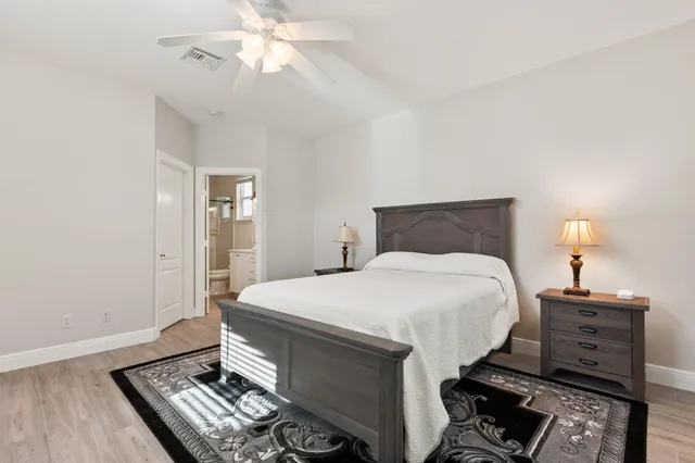 a view of a patio with a table chairs and a umbrella