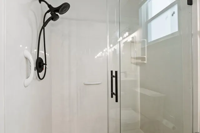 a view of a house with a yard and a garage