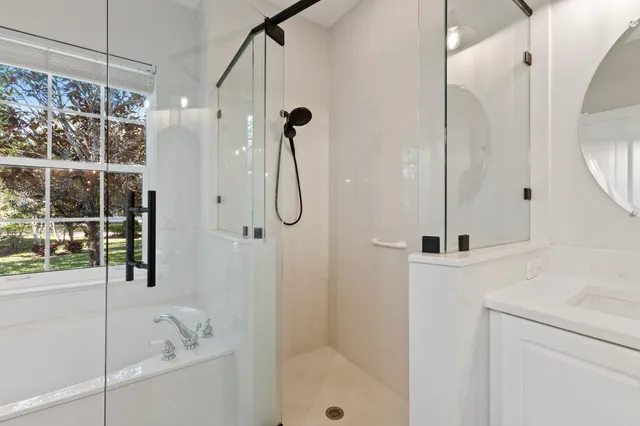 an aerial view of a house with swimming pool and garden