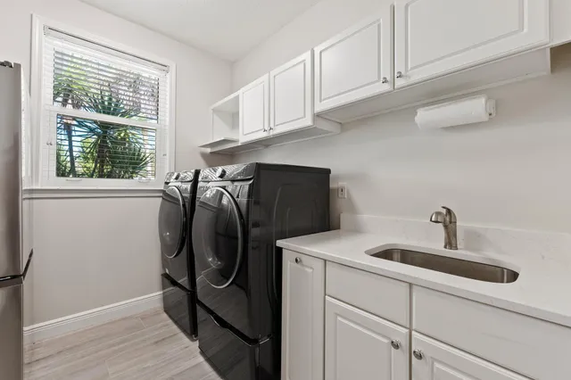 a view of a house with a yard and a garage