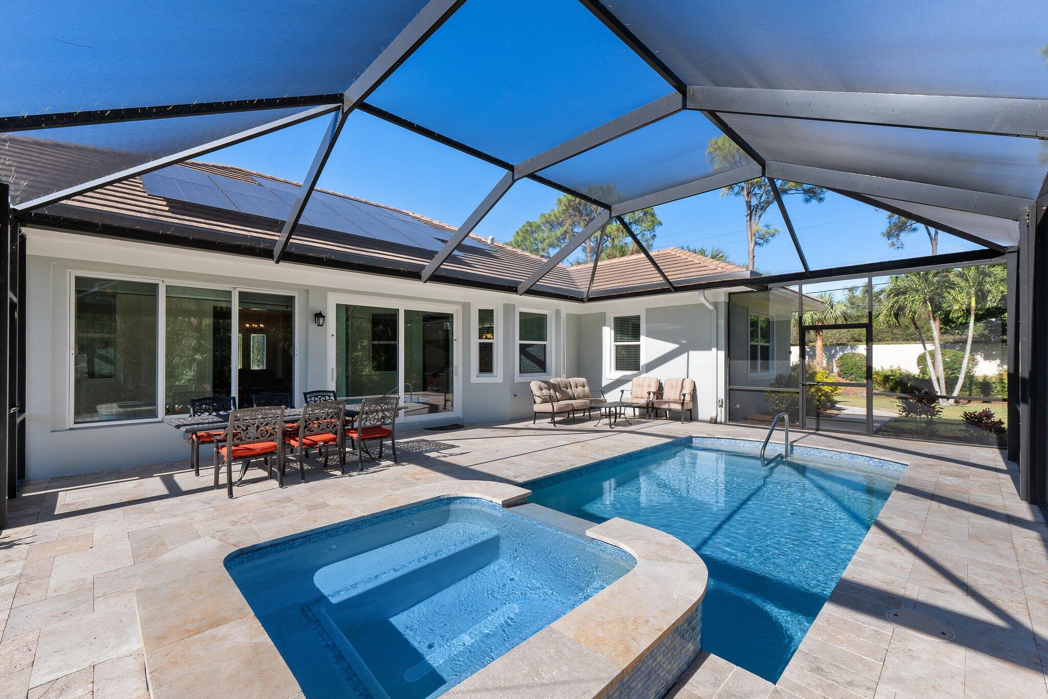 1680 Southeast Cypress Glen Way Stuart, FL 34997 - Photo 51 of 76 a view of a backyard with sitting area
