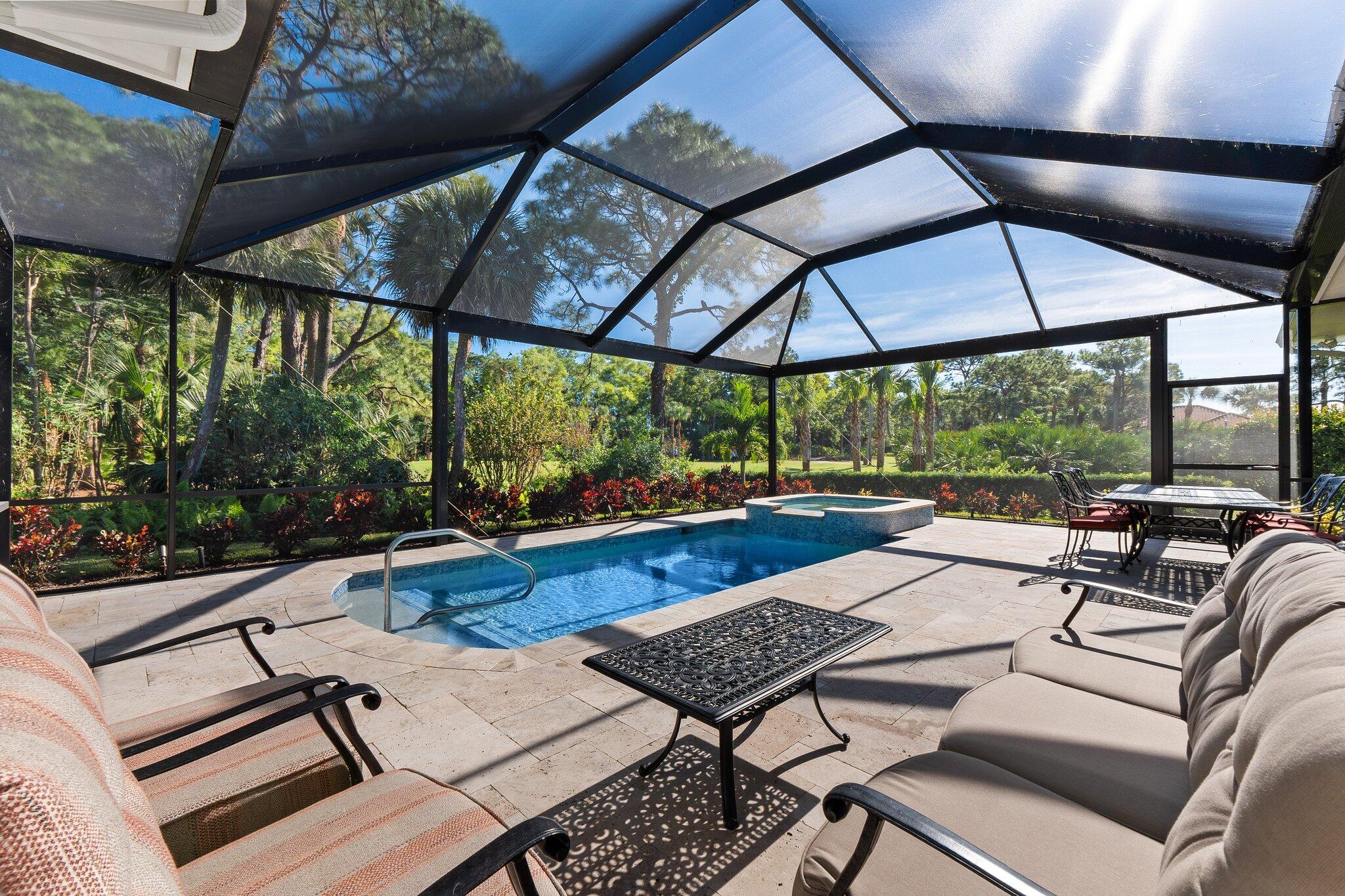 1680 Southeast Cypress Glen Way Stuart, FL 34997 - Photo 54 of 76 a view of a patio with a table chairs and a umbrella