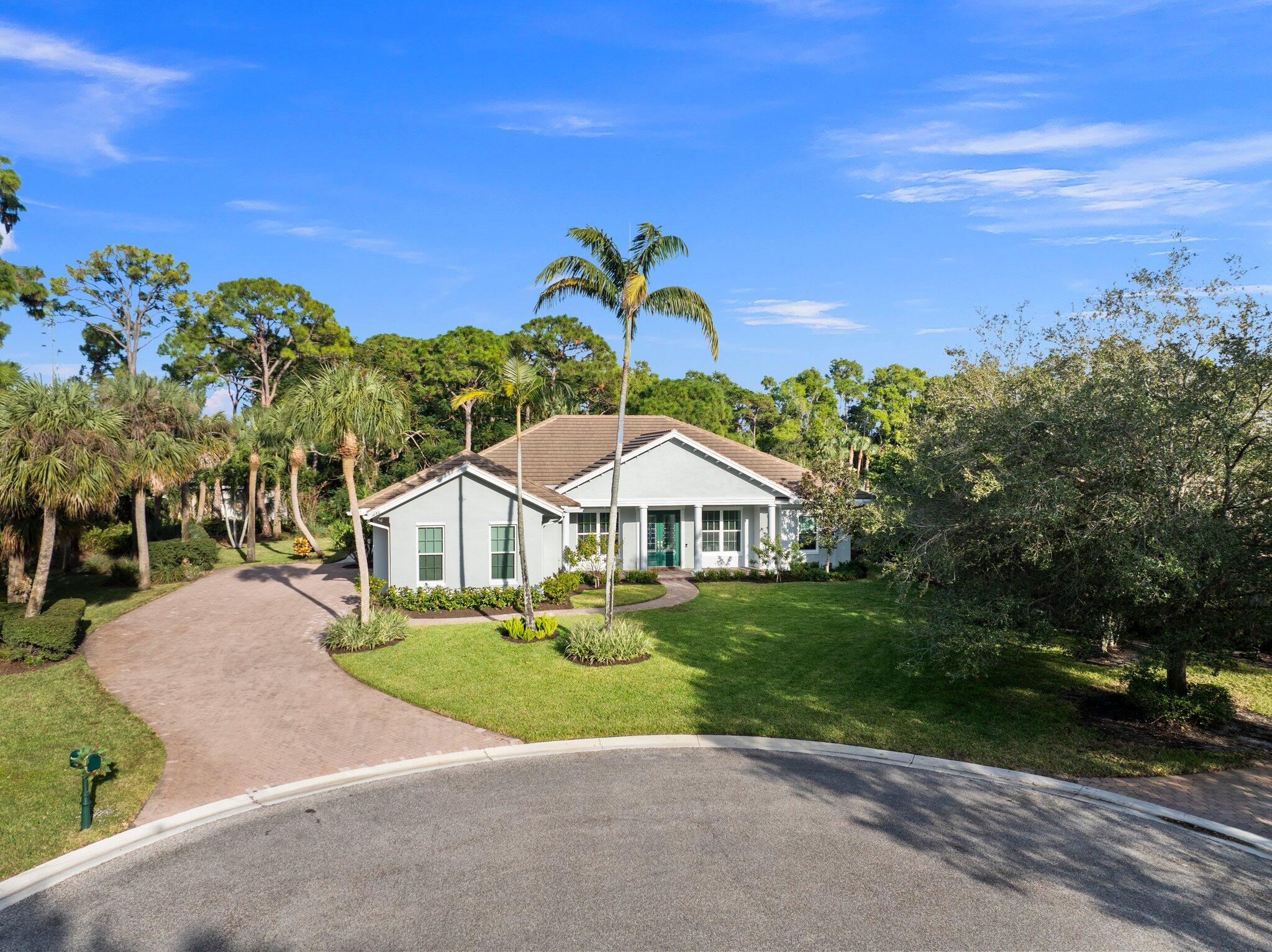 1680 Southeast Cypress Glen Way Stuart, FL 34997 - Photo 64 of 76 a view of a house with a yard and street view