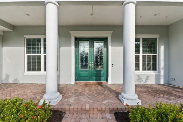 a living room with furniture a ceiling fan and a rug